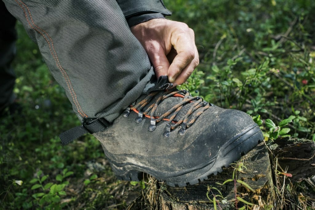 Close-up of a protective boot with toe cap, saw protection and deep treaded sole